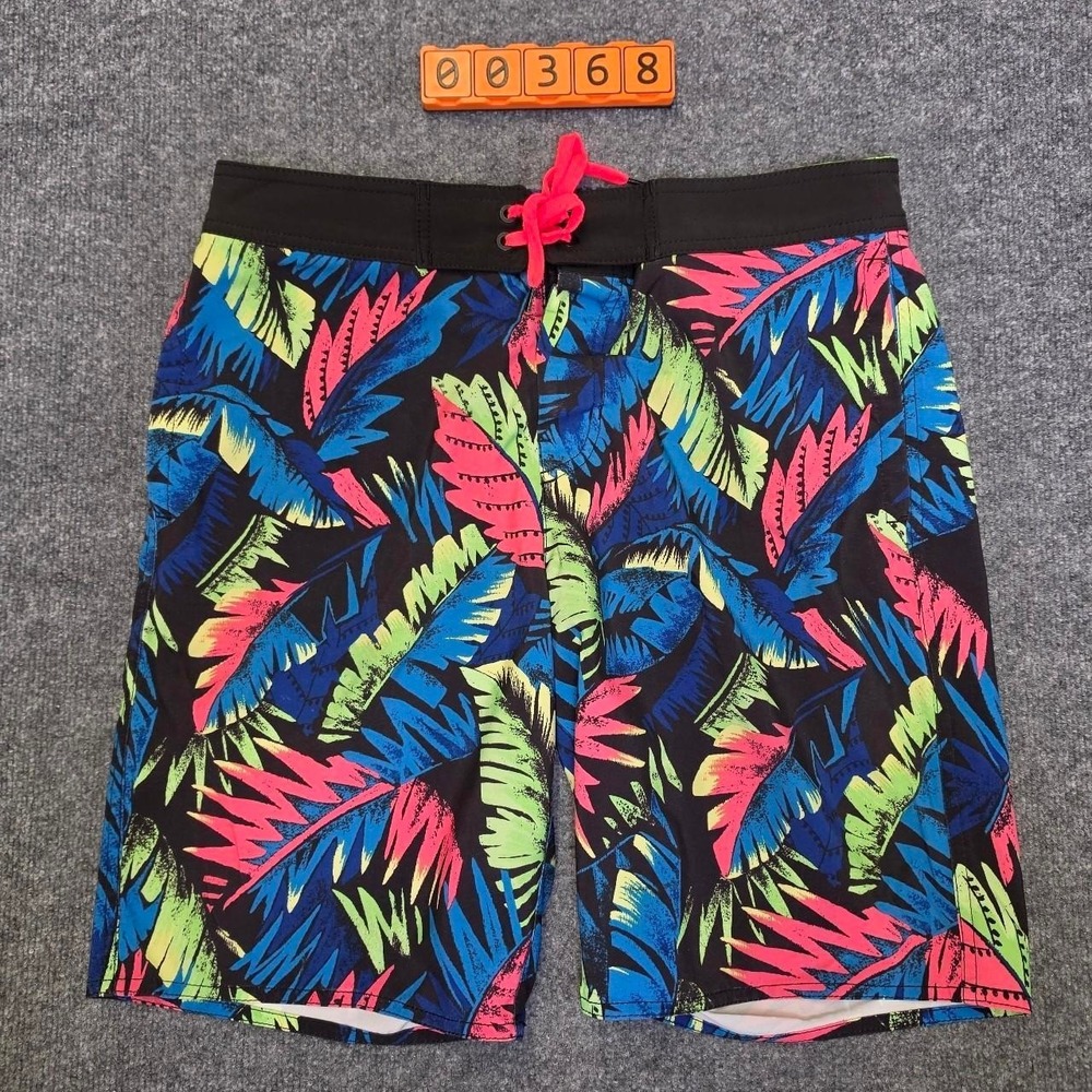 American Eagle Outfitters board shorts with multicolored tropical leaf print.